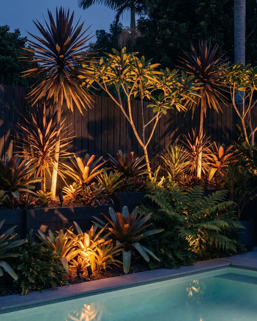Lit planting along a pool edge